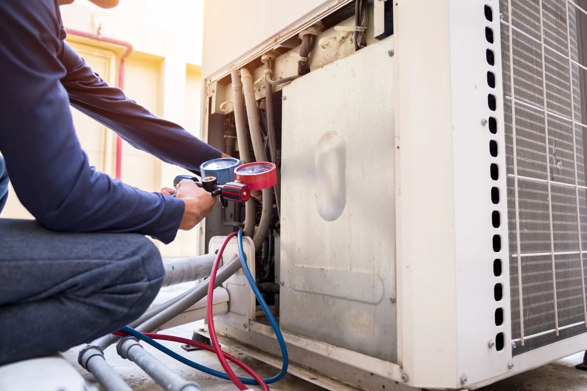 technician-is-checking-air-conditioner-measuring-equipment-filling-air-conditioners